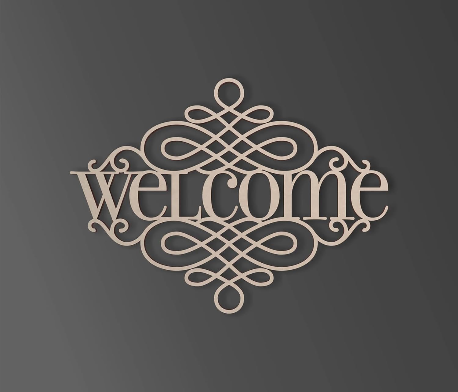 Decorative metal welcome sign with intricate designs on a dark background