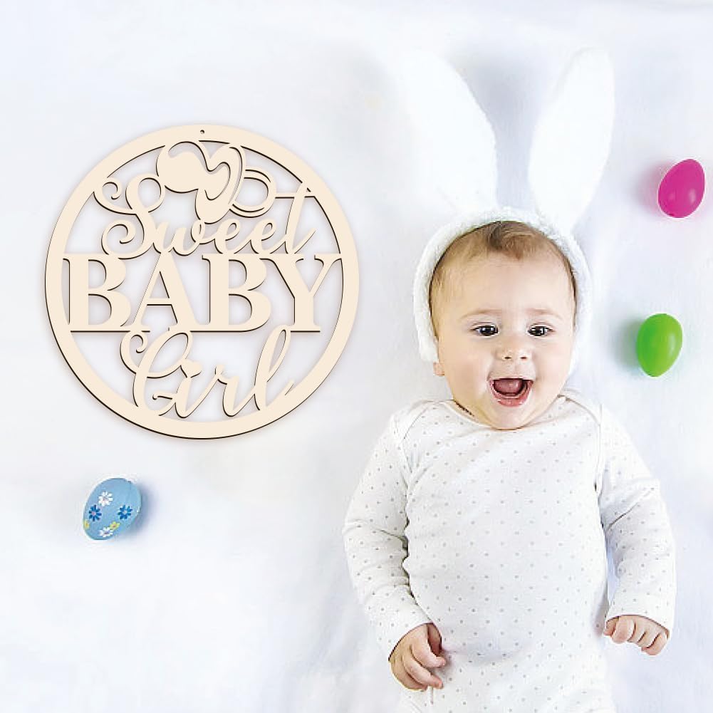 Baby in a white outfit with a 'Sweet Baby Girl' wooden sign on a white background