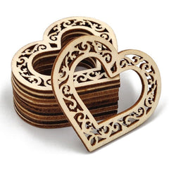 Stack of wooden heart-shaped coasters with intricate cut-out designs on a white background