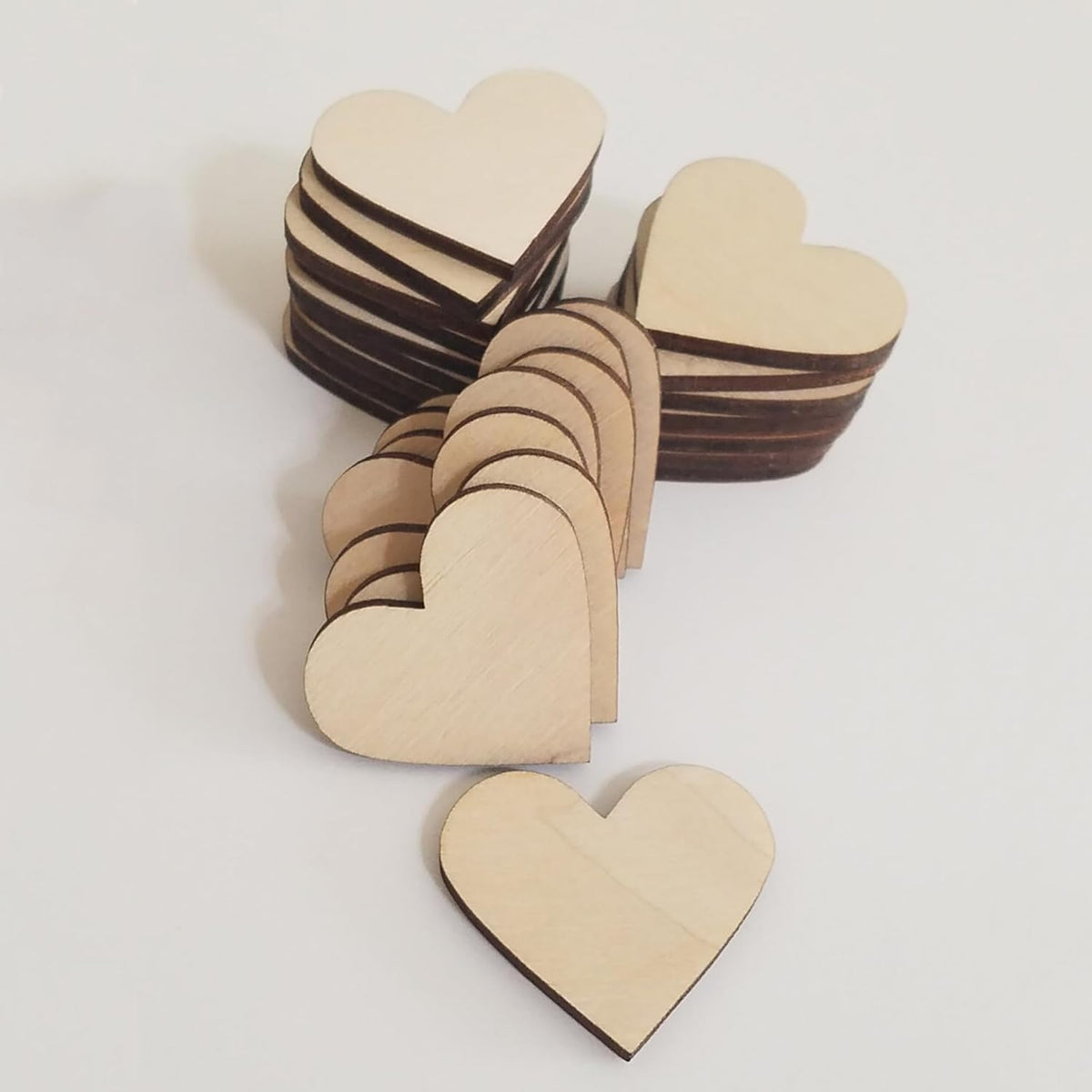 Wooden heart-shaped pieces on a white background