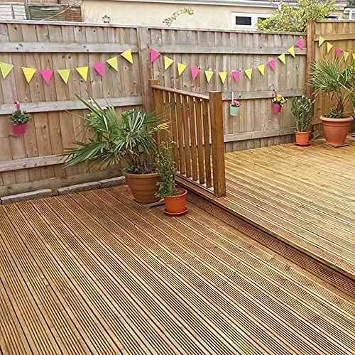 Wooden deck with potted plants and a decorative banner on a wooden fence.