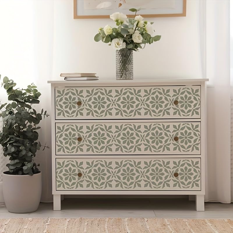 Decorative chest of drawers with floral patterns in a room setting.