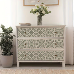Decorative chest of drawers with floral patterns in a room setting.