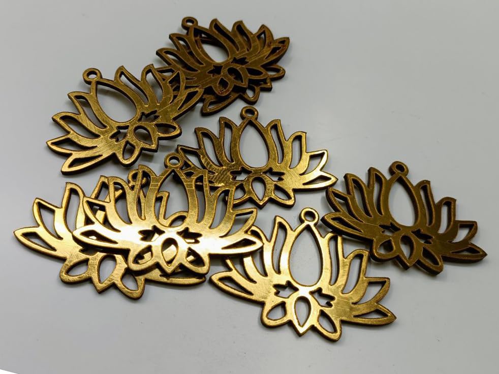 Gold floral-shaped metal decorations on a gray background