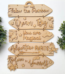 Wooden sign with motivational phrases on a white background