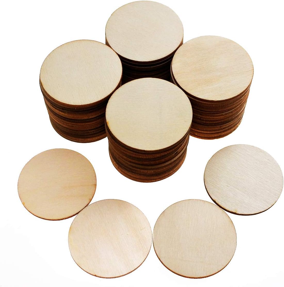 Stacks of round wooden discs on a white background