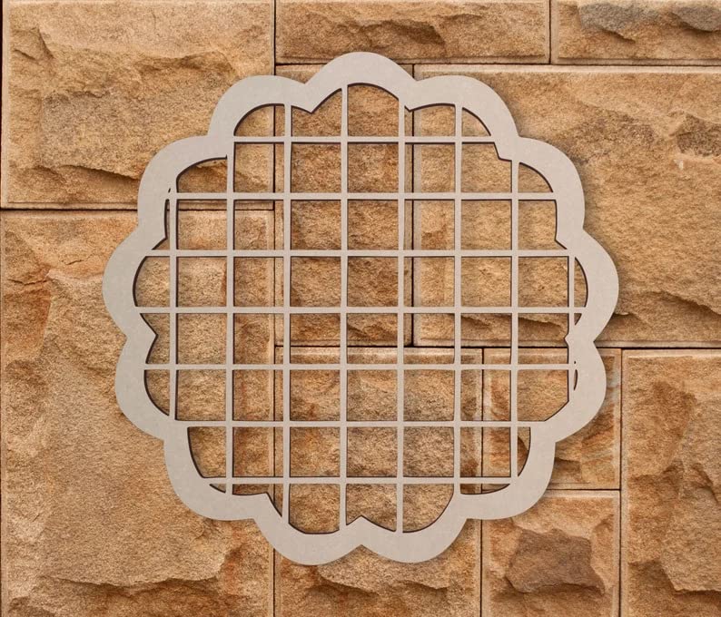 Decorative metal grid on a stone wall