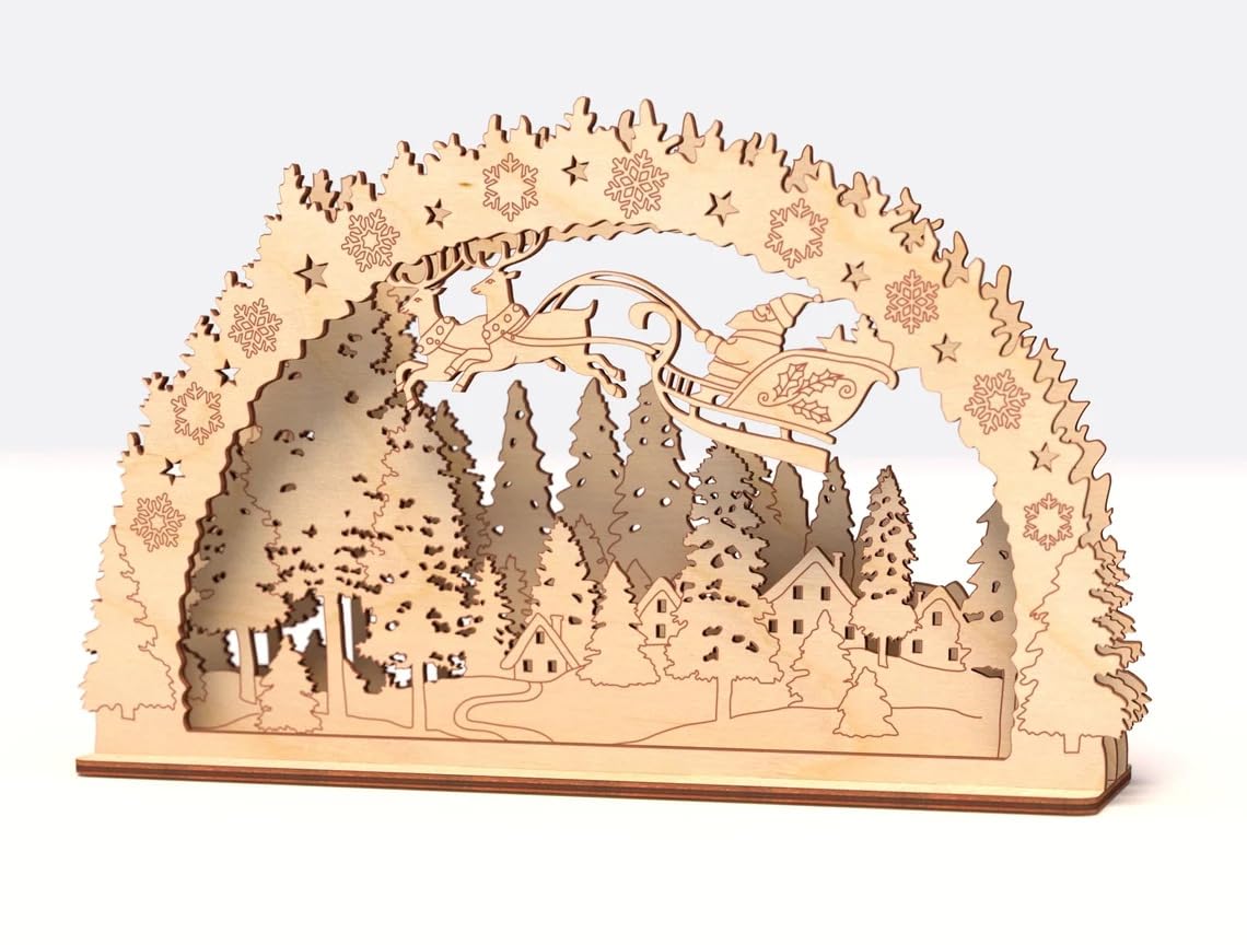 Wooden arch with laser-cut Christmas scene featuring a sleigh and trees on a white background
