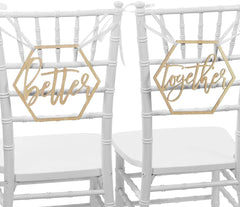 White chairs with gold 'better together' signs on a white background