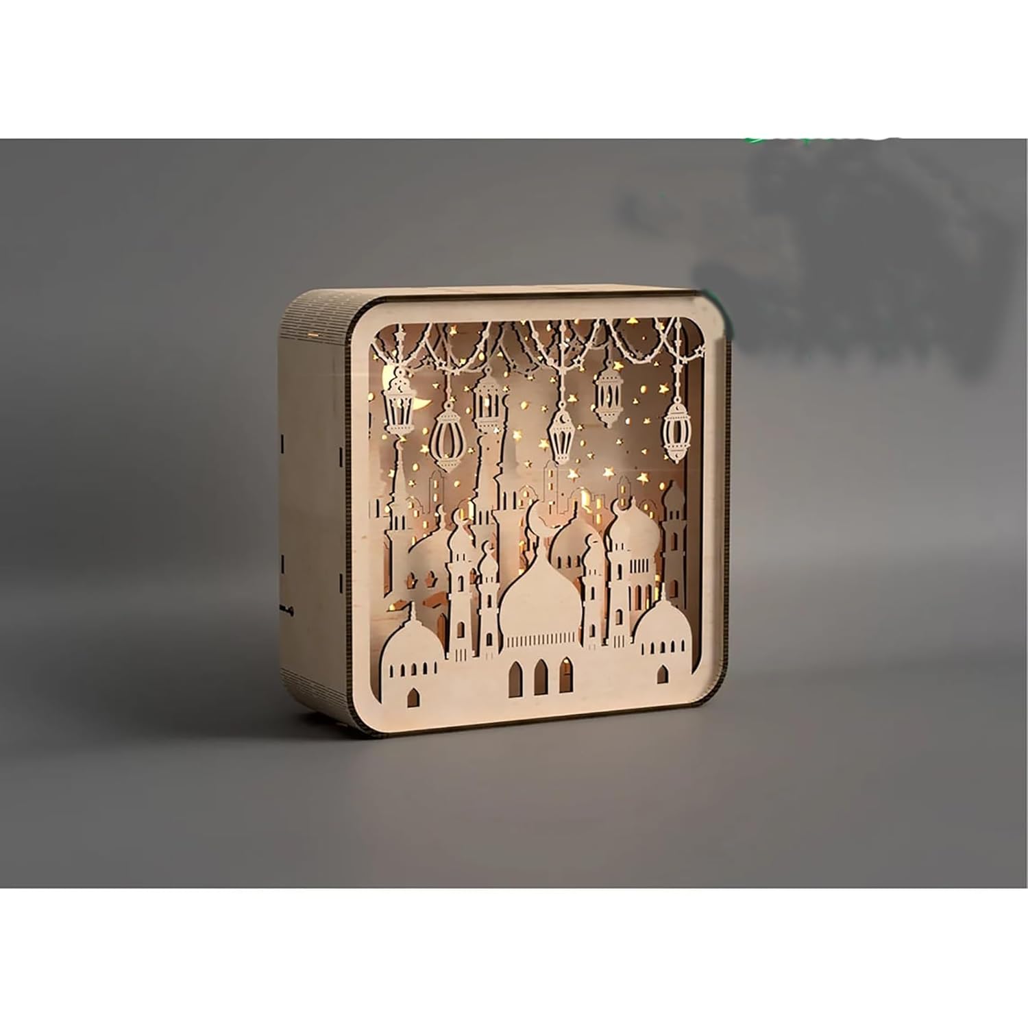 Decorative wooden box with cut-out designs on a gray background
