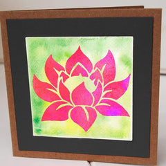 Card with a pink lotus flower design on a green and black background