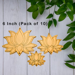 Three wooden lotus flower decorations on a light gray wooden surface with green leaves.