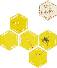 Hexagonal tiles with bee designs and a 'Bee Happy' patch on a white background