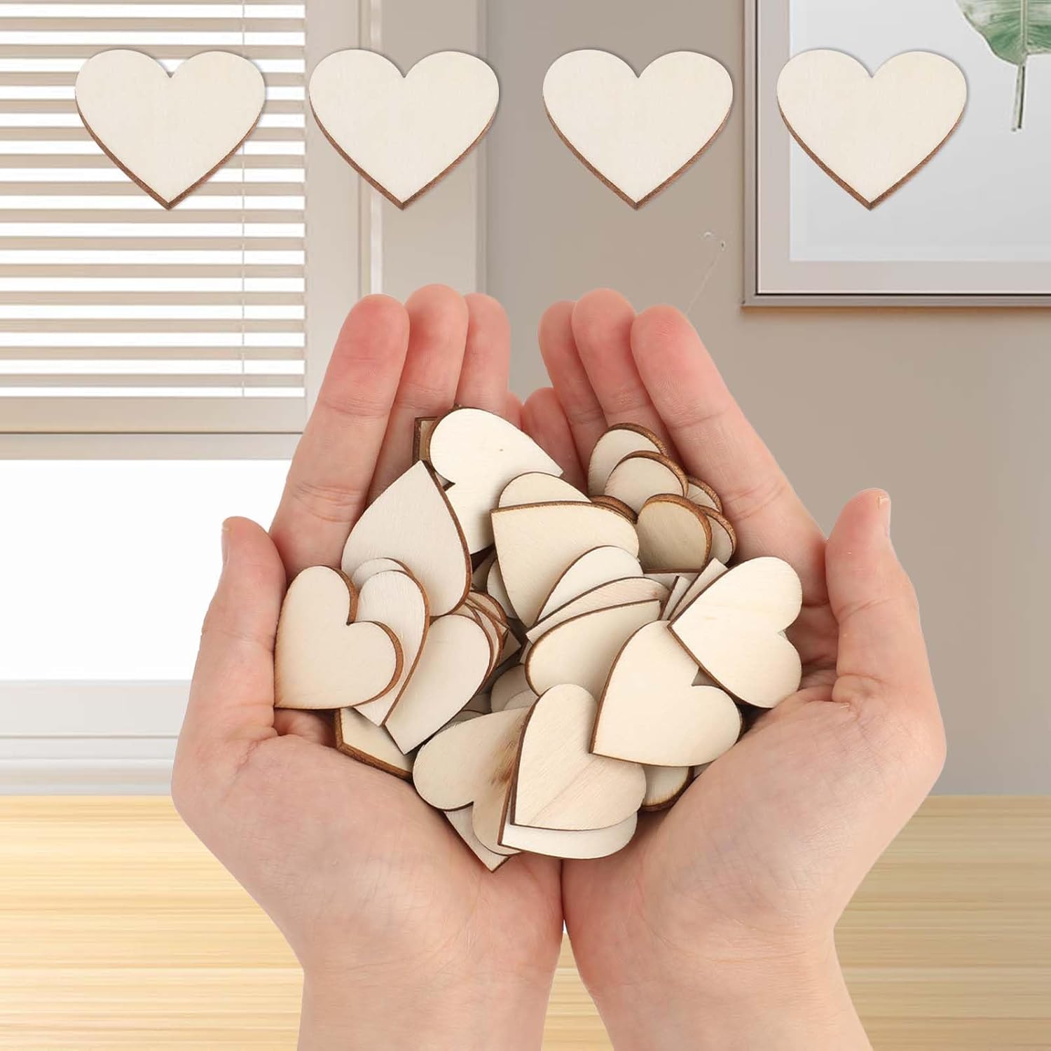 Hands holding wooden heart shapes with a neutral background