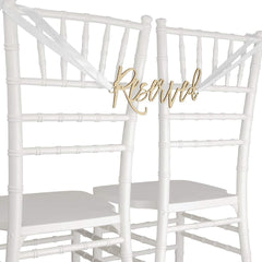 White chairs with gold 'Reserved' sign on a white background