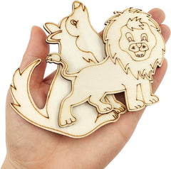 Wooden cutout of a lion and a dragon held in a hand against a white background
