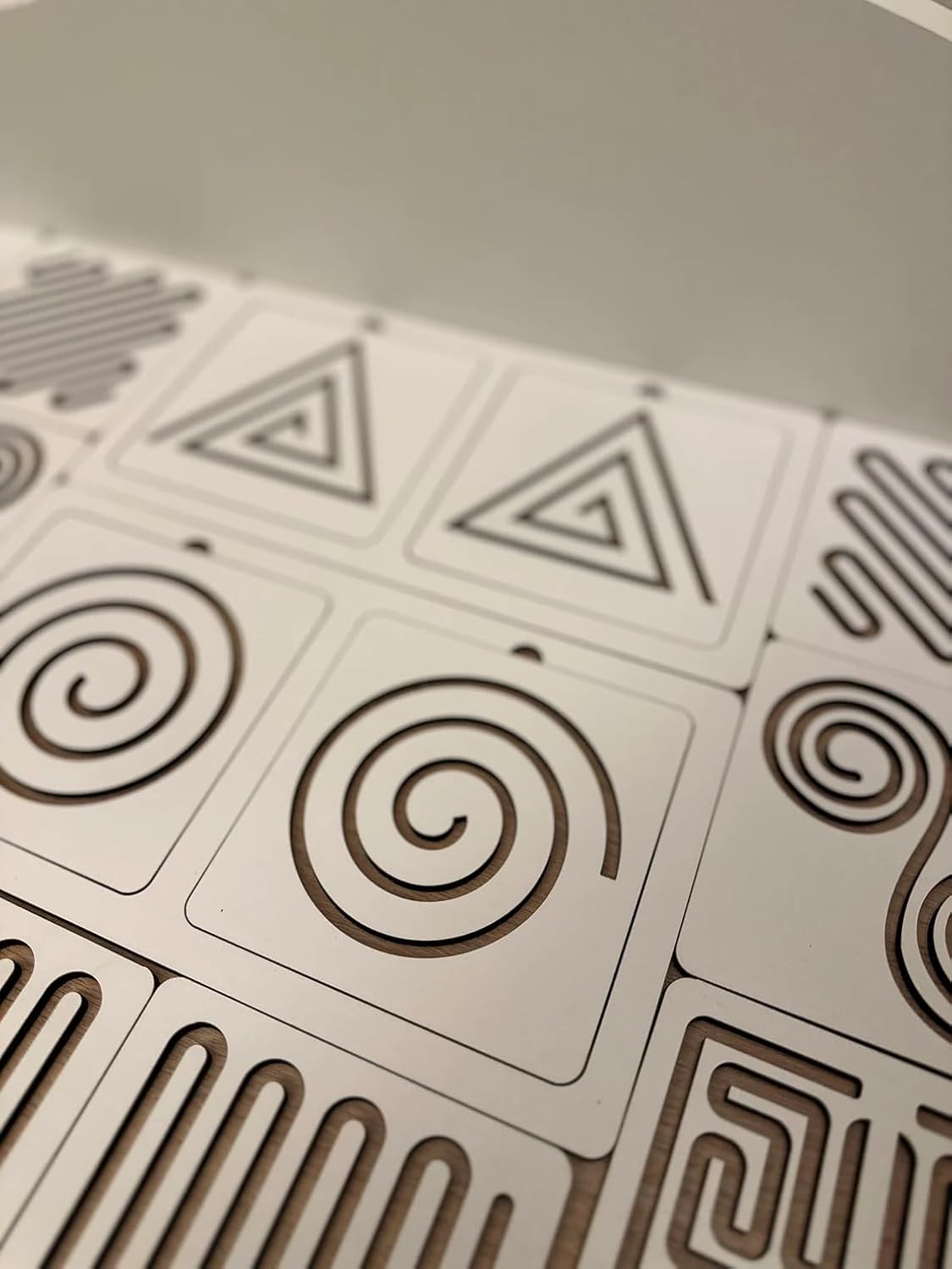 Close-up of geometric patterned tiles on a flat surface