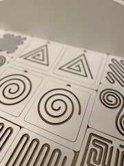 Close-up of geometric patterned tiles on a flat surface