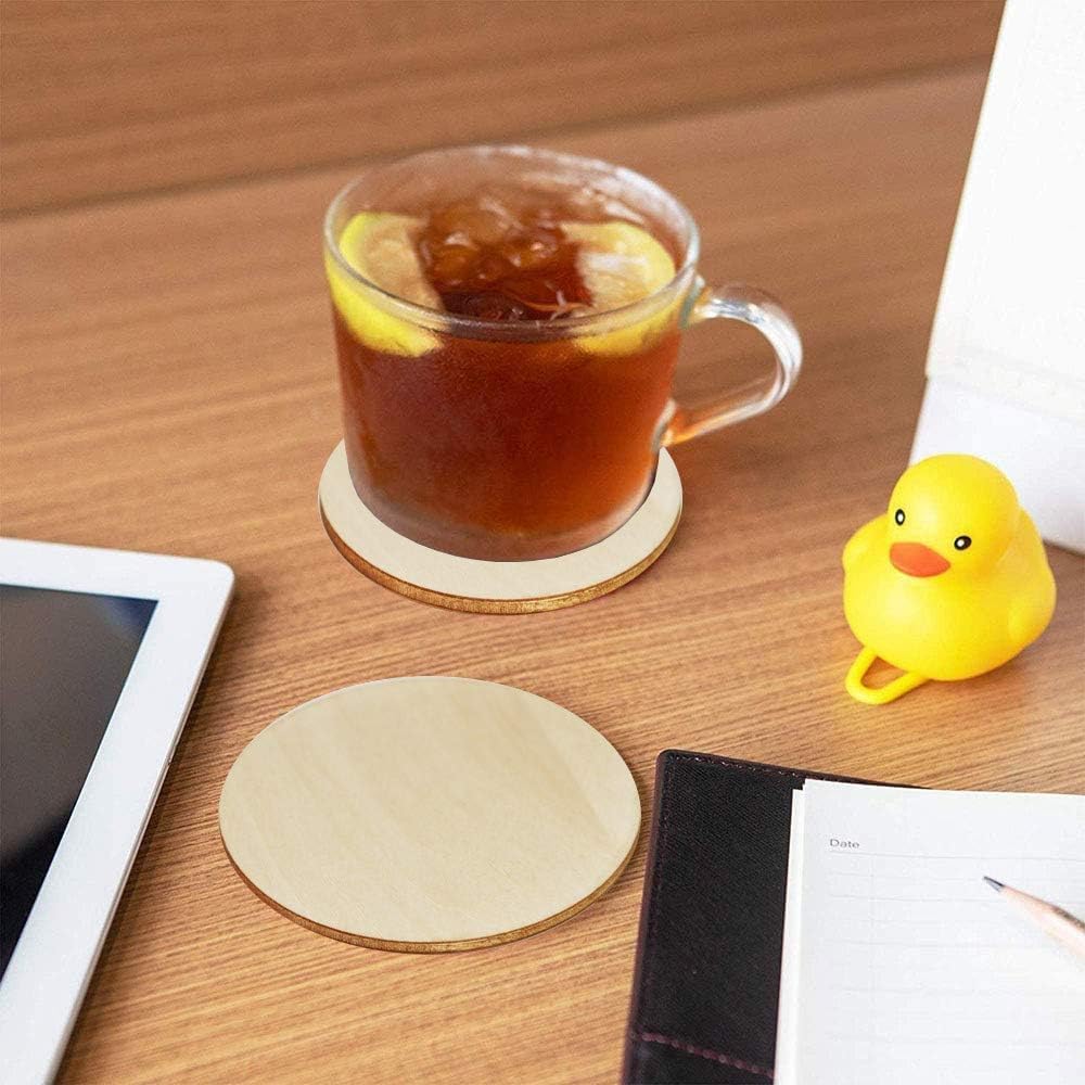 Clear glass mug with iced tea on a wooden table next to a yellow rubber duck and a tablet.