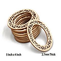 Stack of wooden rings with intricate patterns on a white background