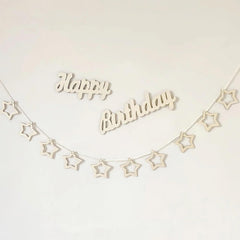 Wooden 'Happy Birthday' banner with star shapes on a white background