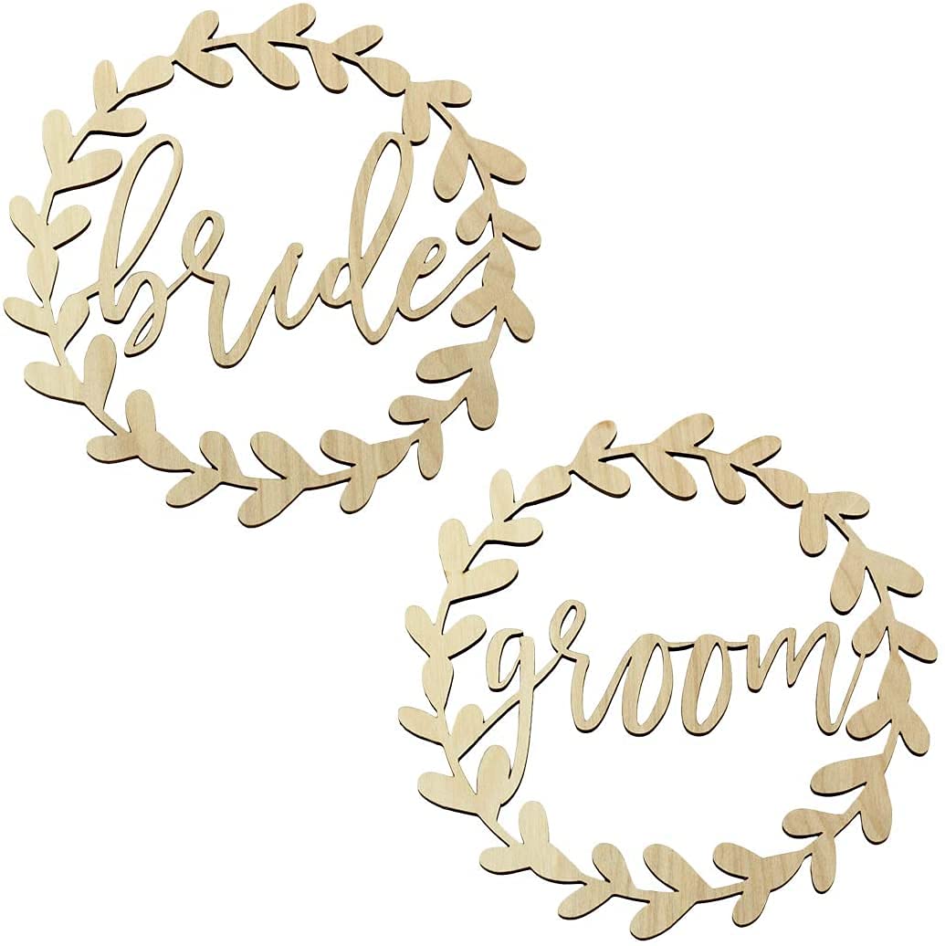 Wooden signs with 'bride' and 'groom' text surrounded by leaf patterns on a white background