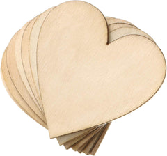 Stack of heart-shaped wooden cutouts on a white background