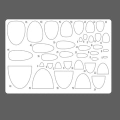 Sheet of oval and curved templates with measurements on a gray background