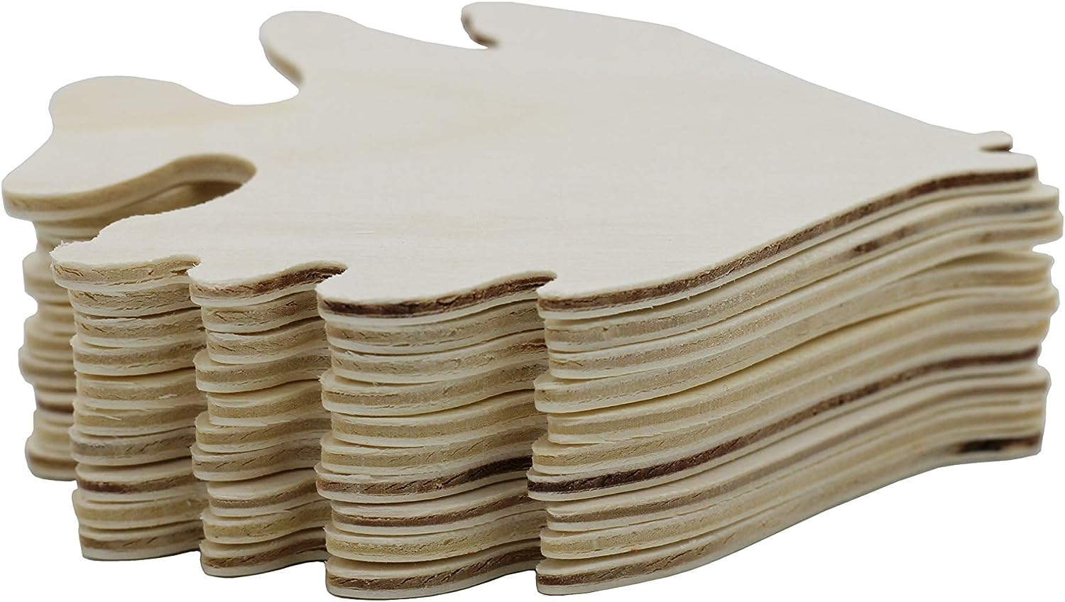 Stack of wooden Christmas tree shapes on a white background