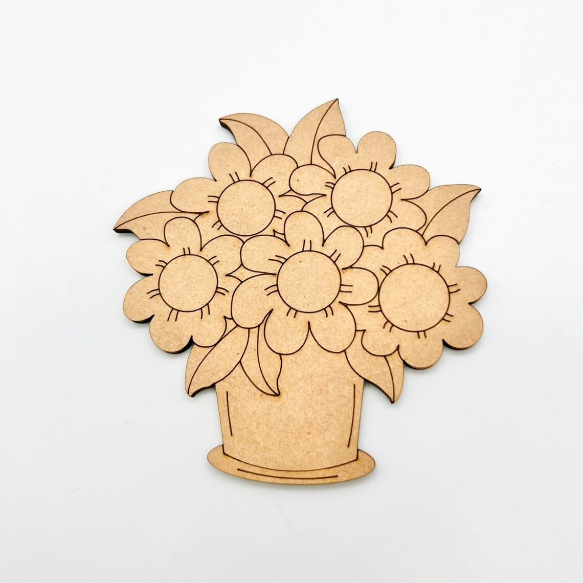 Wooden cutout of a flower arrangement on a white background