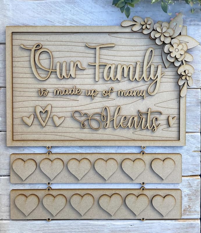 Wooden decorative sign with 'Our Family is made up of many Hearts' text and heart shapes on a wooden background.