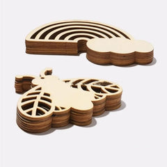 Wooden coasters shaped like a cloud and a leaf on a white background