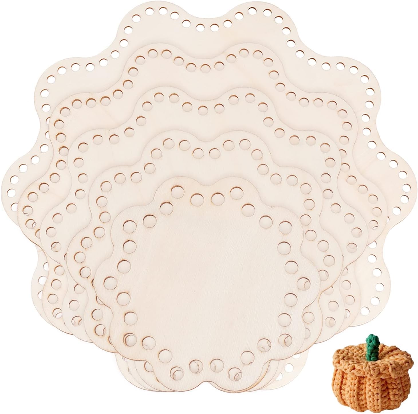 Set of beige doily placemats with a small crochet pumpkin on a white background