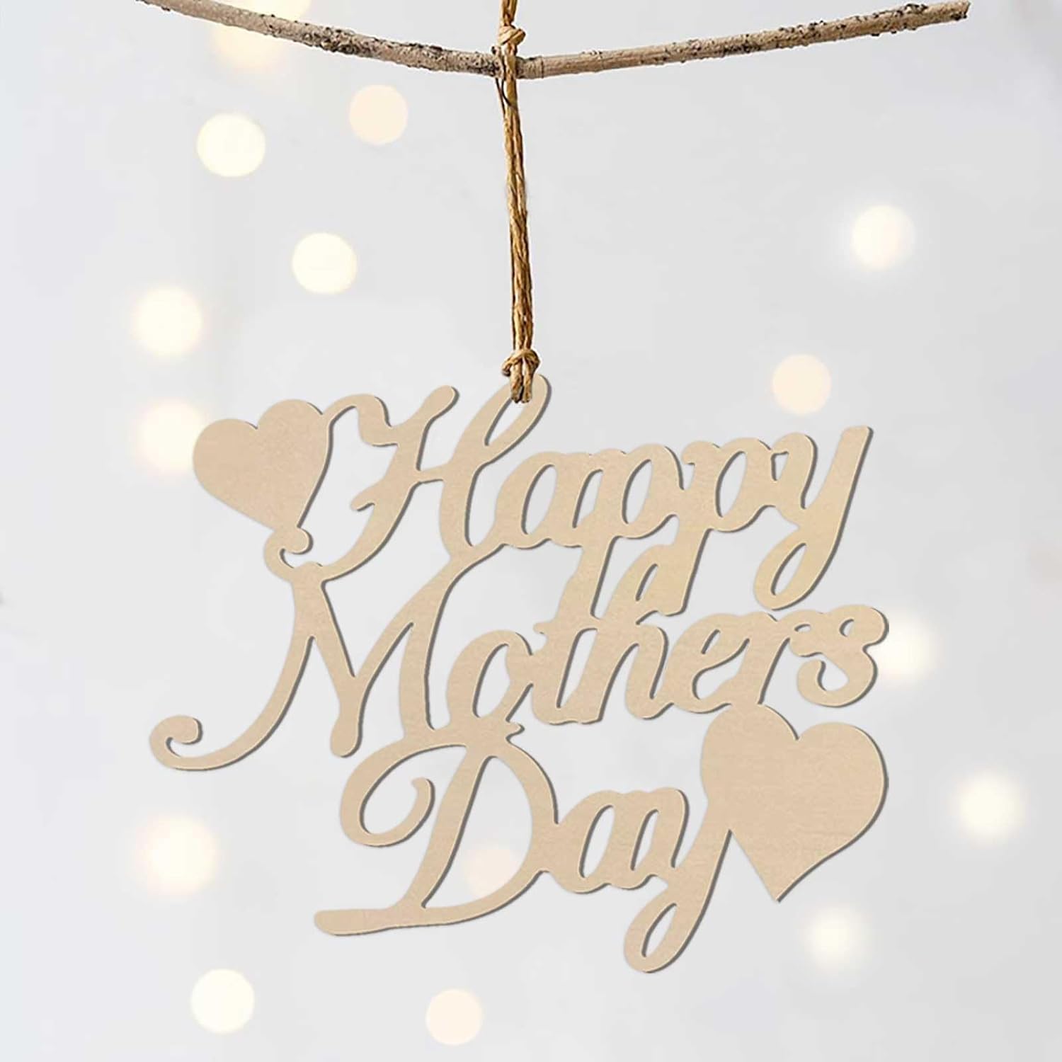 Wooden 'Happy Mother's Day' decoration hanging against a soft, blurred light background.