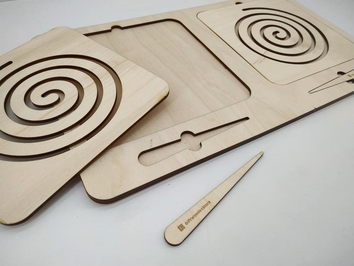 Wooden laser-cut cutting boards with spiral patterns and a knife on a light gray background