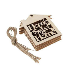 Stack of wooden house-shaped signs with 'Home Sweet Home' text on a white background
