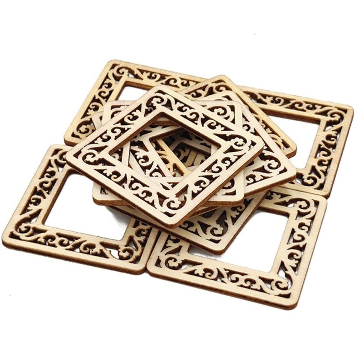 Set of square wooden coasters with intricate carvings on a white background