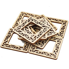 Set of square wooden coasters with intricate carvings on a white background