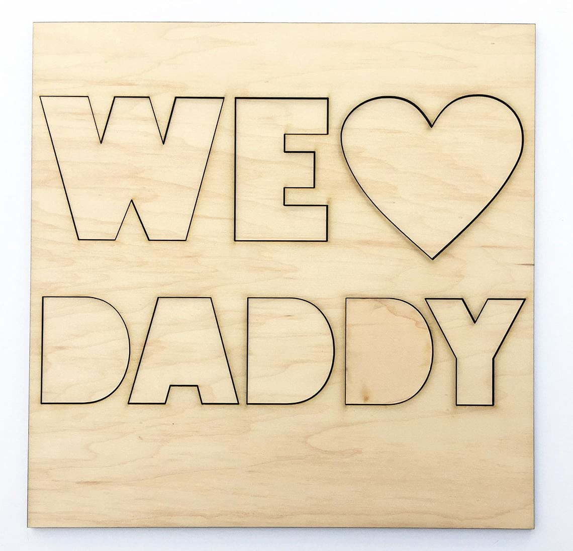 Wooden cutout with 'WE LOVE DADDY' text on a white background