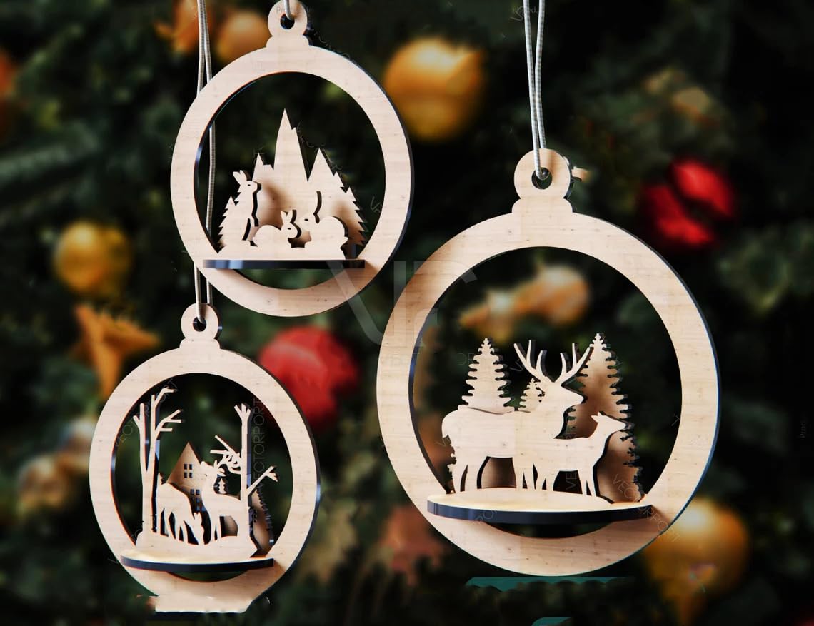Wooden Christmas ornaments with cut-out scenes of a village and deer on a tree background.