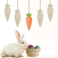 White rabbit with a basket of Easter eggs next to hanging carrot decorations on a white background