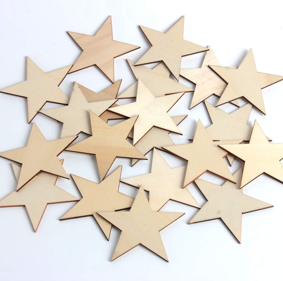 Collection of wooden star shapes on a white background