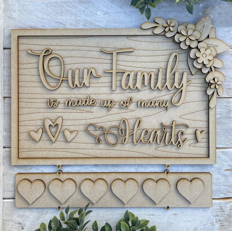 Wooden decorative sign with 'Our Family is made up of many hearts' text and heart shapes on a wooden background.