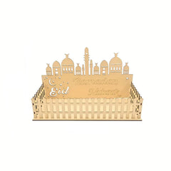 Decorative cake topper with 'Eid Mubarak' text and architectural design on a white background