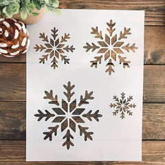 Set of snowflake stencils on a wooden surface with decorative elements.