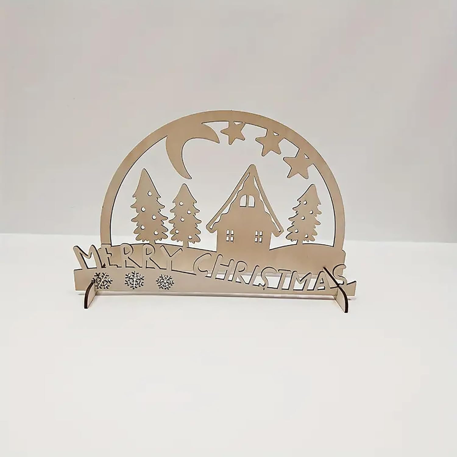 Decorative Christmas sign with a house, trees, and 'Merry Christmas' text on a white background