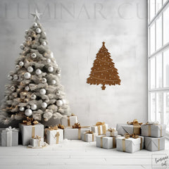 Decorative Christmas tree with ornaments and presents in a room with a wall art of a Christmas tree.