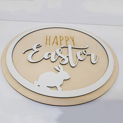 Decorative sign with 'Happy Easter' text and a rabbit silhouette on a beige background.