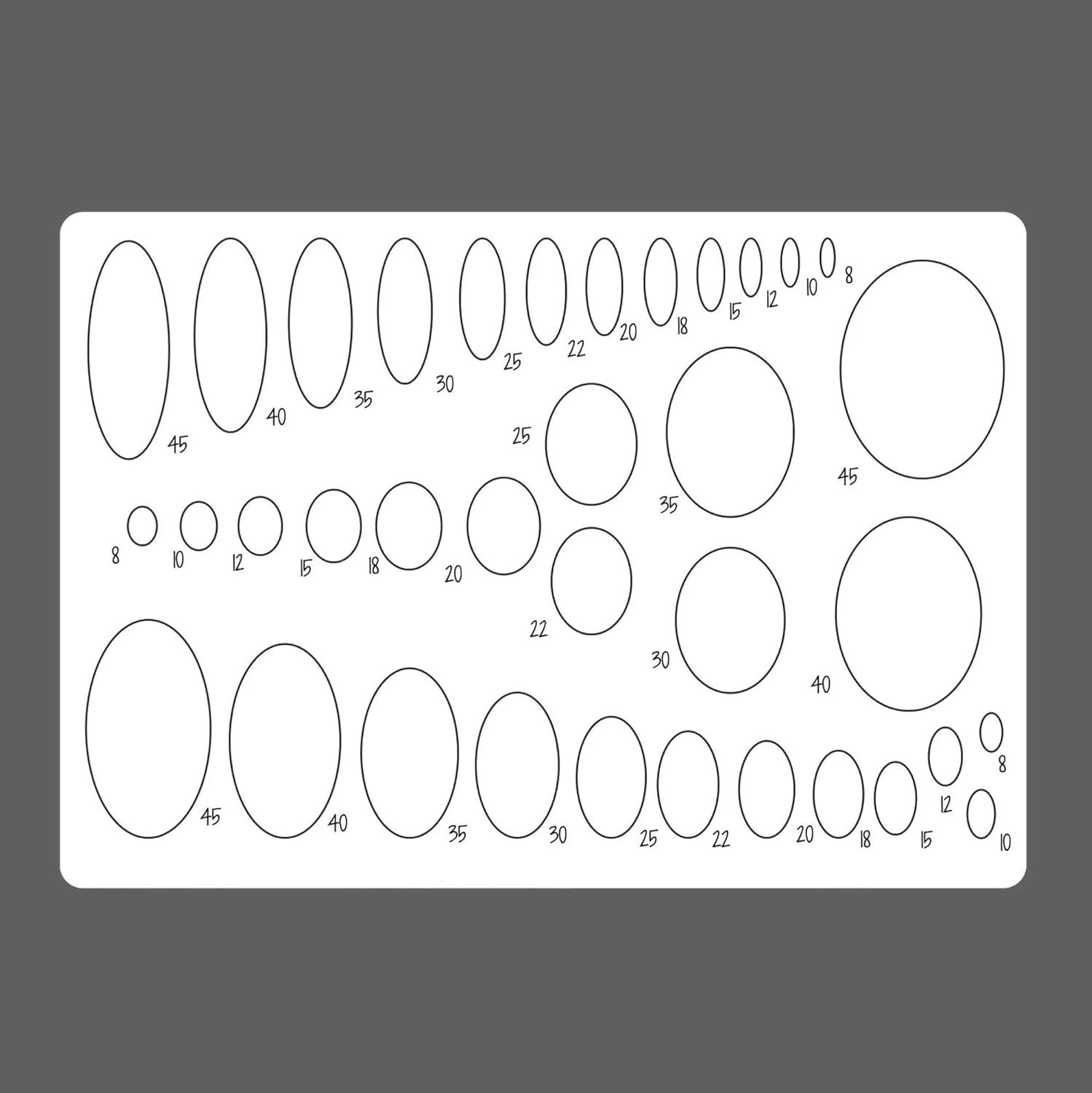 Sheet of oval and circular stencils with measurements on a gray background