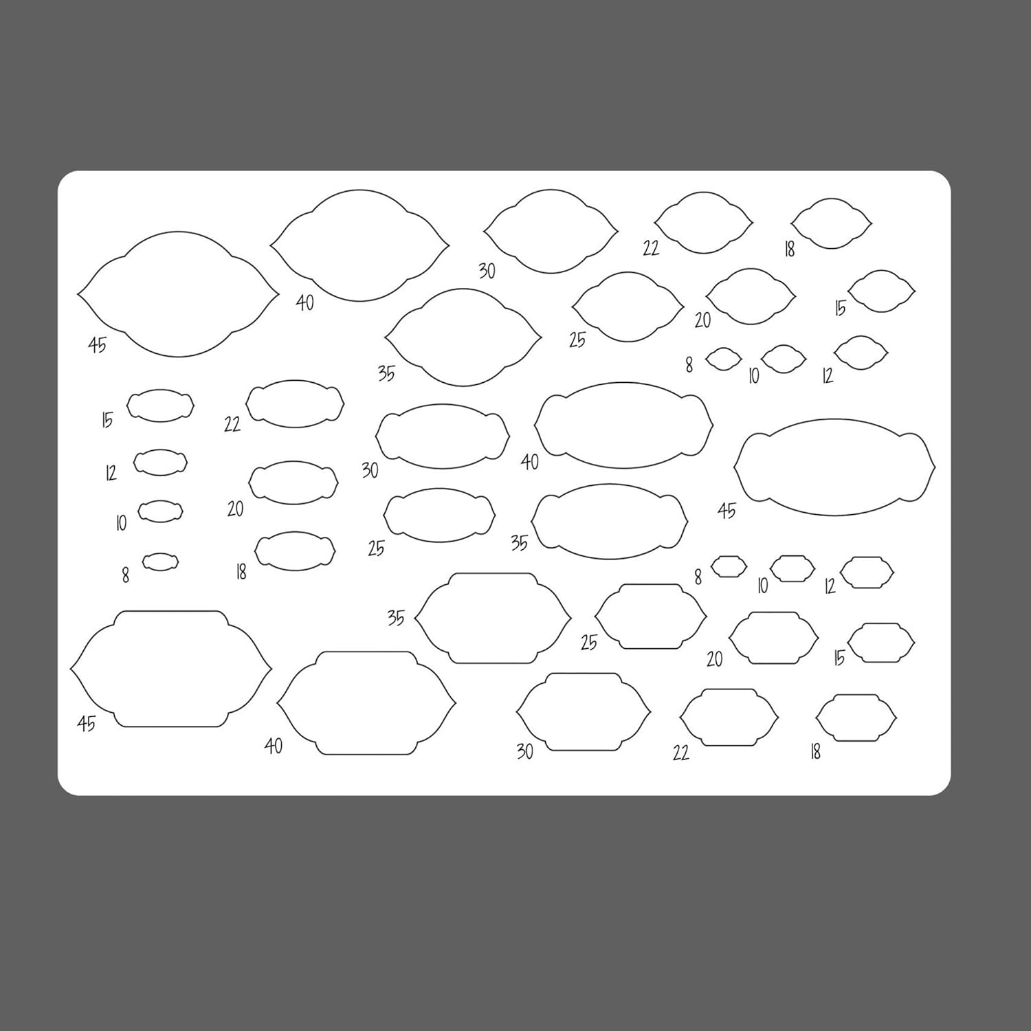 Sheet of pre-cut shapes with numbers on a gray background